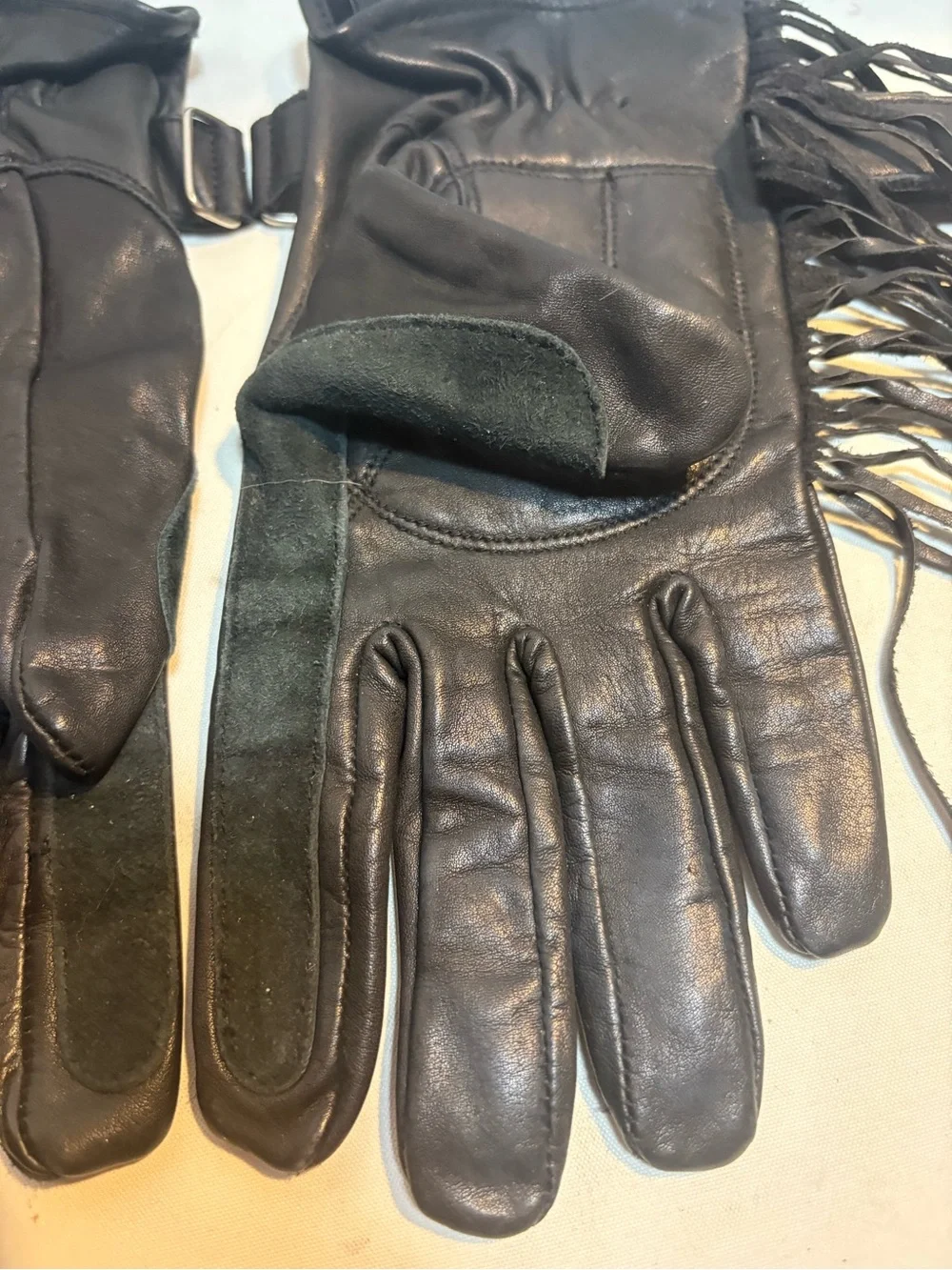 Women’s black leather motorcycle gloves fringe detailing adjustable closure